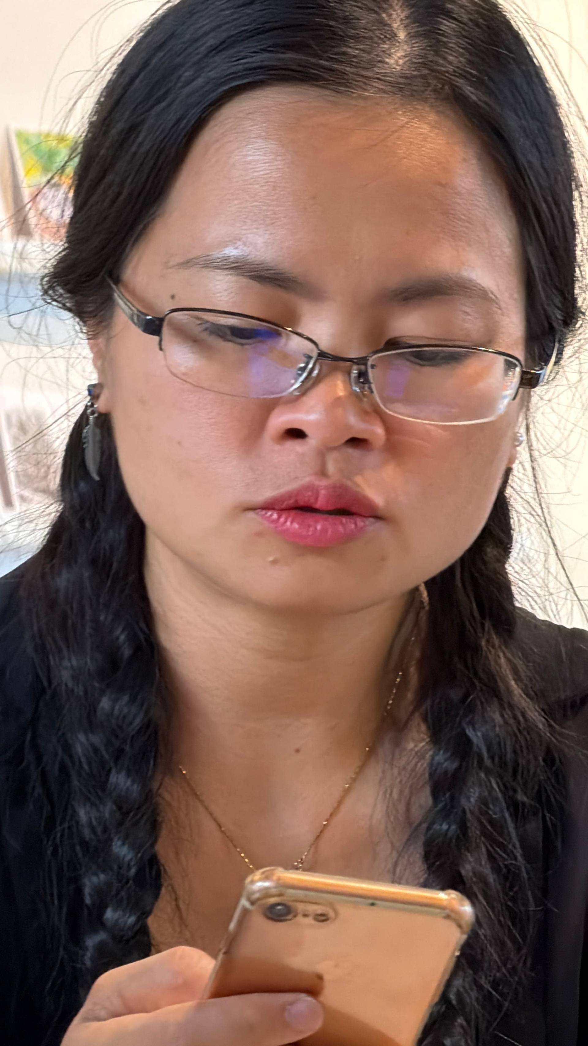 A visitor browsing through a contemporary art space in Đà Lạt, surrounded by curated gallery exhibitions and local artistic displays.